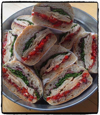 Chicken Sandwich with Tapenade, Roasted Red Peppers &  Arugula from Black Eyed Suzie's Café and Catering Saugerties NY